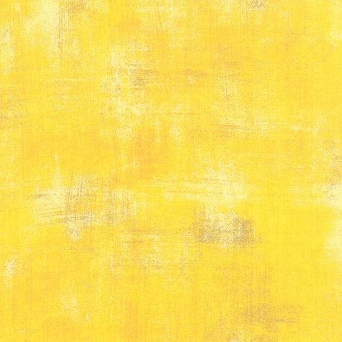 Het meest zonnige en intense geel in het Grungespectrum. Opvallend en levendig, met lichte en beige vlekken en oranje vegen. Quiltstof, 100% katoen