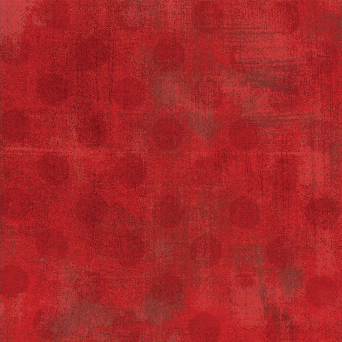 Red Grunge Hits the Spot is rood verlevendigd met iets donkerder stippen. Quiltstof 100% katoen.